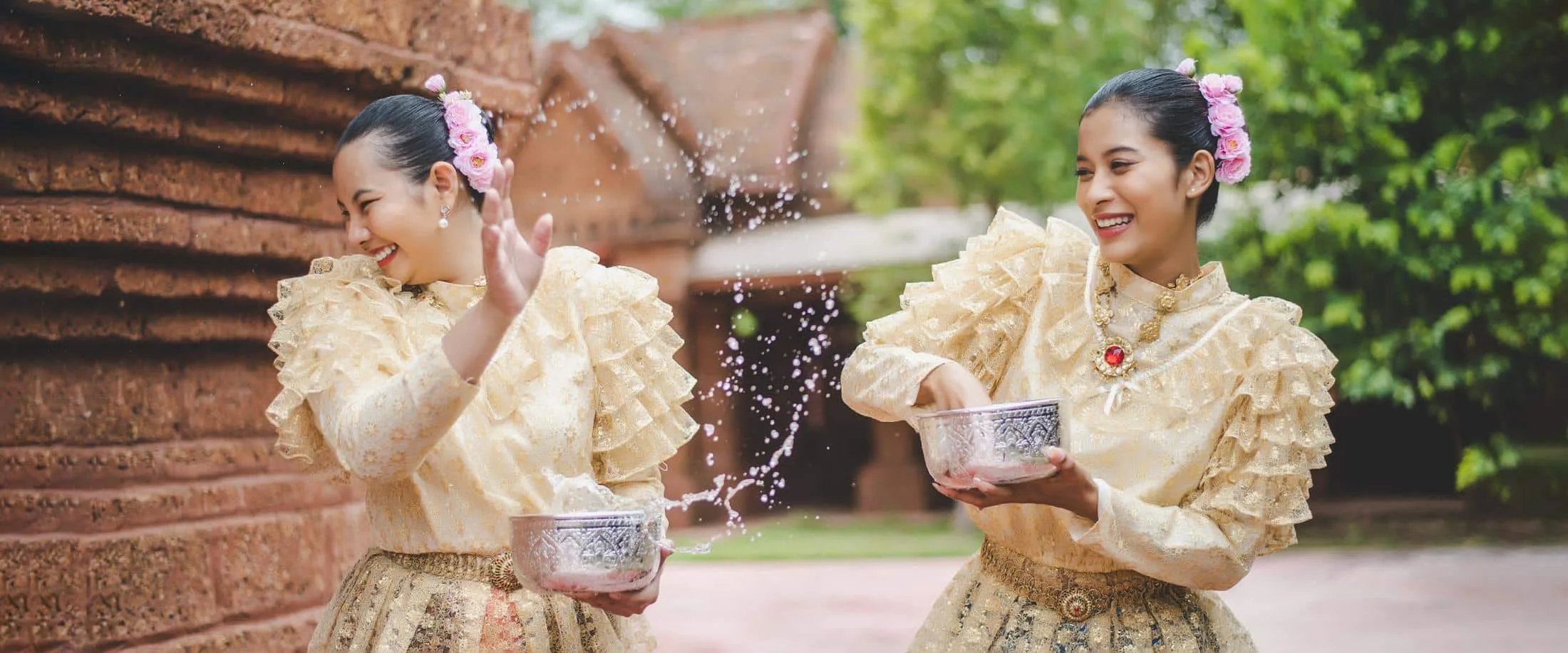 young smiling women dress beautiful thai costumes splashing water temples preserve good culture thai people songkran festival thai new year family day shopmaak